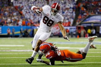 ATLANTA, GA - DECEMBER 03:  Marcell Harris #26 of the Florida Gators tackles O.J. Howard #88 of the Alabama Crimson Tide in the first half during the SEC Championship game at the Georgia Dome on December 3, 2016 in Atlanta, Georgia.  (Photo by Kevin C. Co