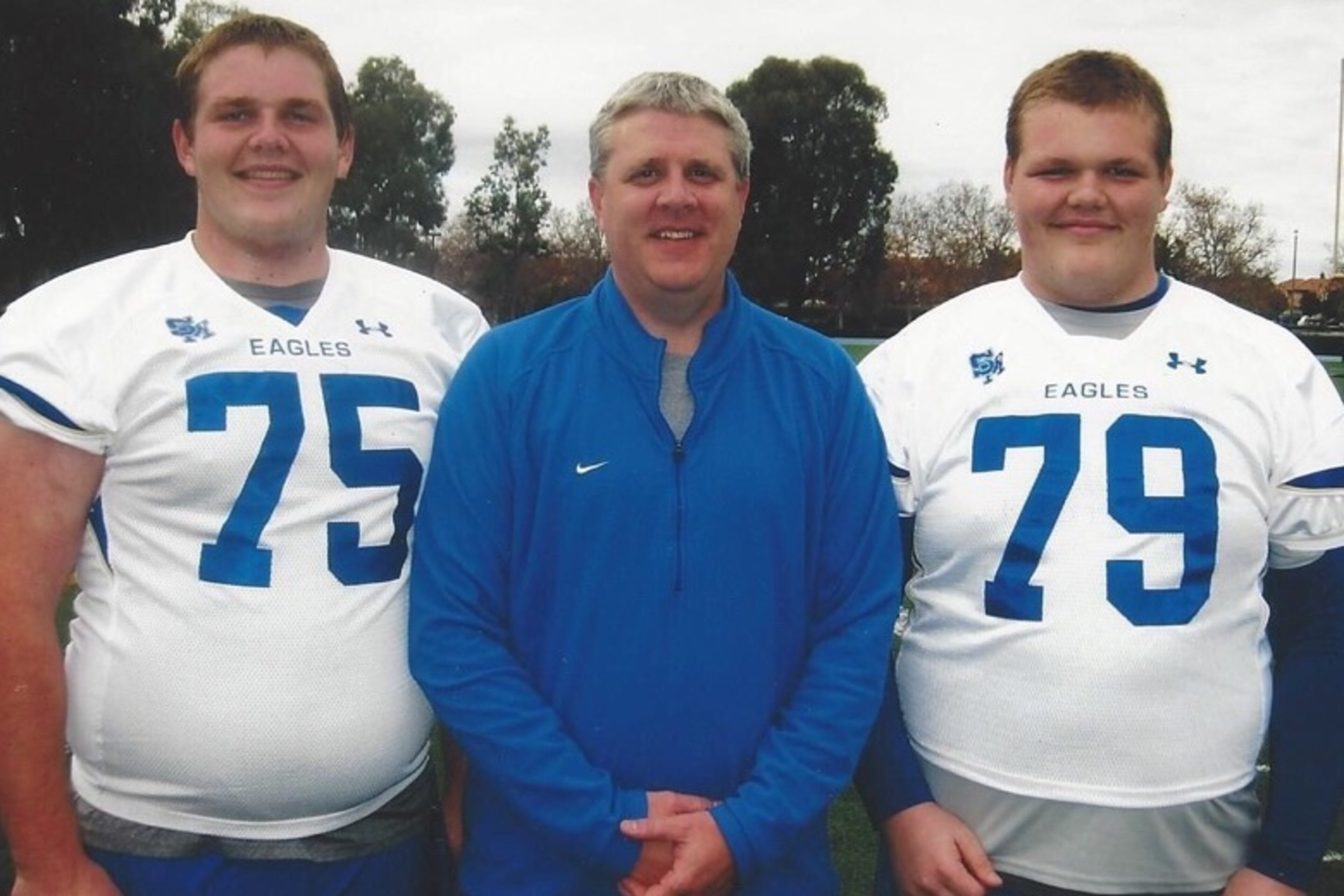Riley with his father, Bart, and his younger brother, Will, while the Sorenson boys were playing football for Santa Margarita High School.