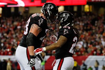 ATLANTA, GA - DECEMBER 18: Devonta Freeman #24 celebrates a touchdown with Ryan Schraeder #73 of the Atlanta Falcons during the first half against the San Francisco 49ers at the Georgia Dome on December 18, 2016 in Atlanta, Georgia. (Photo by Kevin C. Cox