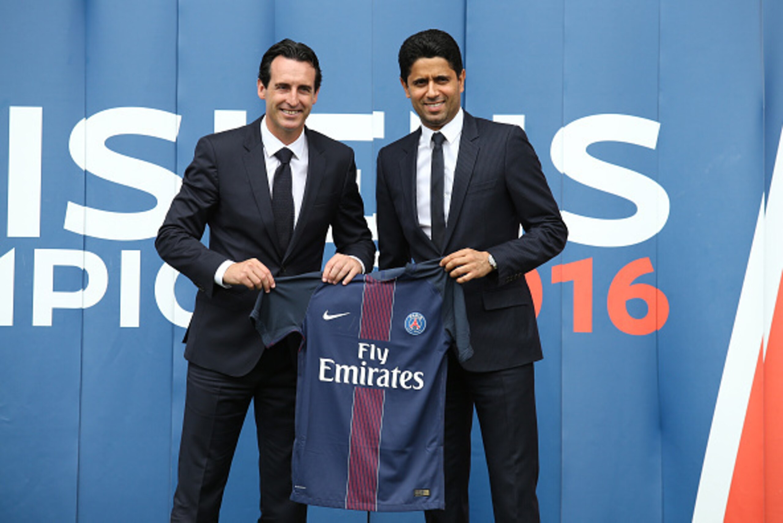 PARIS, FRANCE - JULY 4: New coach of French Ligue 1 football club Paris Saint-Germain Unai Emery of Spain has his jersey presented by President of PSG Nasser Al-Khelaïfi at Parc des Princes stadium on July 4, 2016 in Paris, France. (Photo by Jean Catuffe/ PARIS, FRANCE - JULY 4: New coach of French Ligue 1 football club Paris Saint-Germain Unai Emery of Spain has his jersey presented by President of PSG Nasser Al-Khelaïfi at Parc des Princes stadium on July 4, 2016 in Paris, France. (Photo by Jean Catuffe/