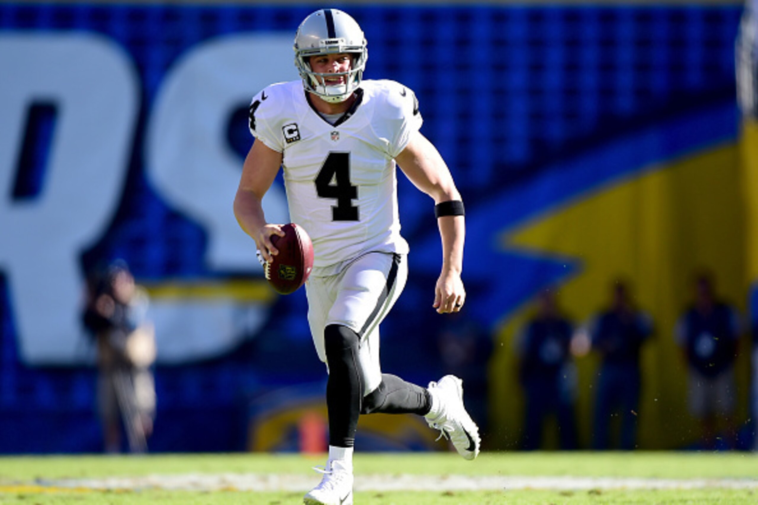 SAN DIEGO, CA - DECEMBER 18: Derek Carr #4 of the Oakland Raiders scrambles out of the pocket for a first down during the first quarter against the San Diego Chargers at Qualcomm Stadium on December 18, 2016 in San Diego, California. (Photo by Harry How SAN DIEGO, CA - DECEMBER 18: Derek Carr #4 of the Oakland Raiders scrambles out of the pocket for a first down during the first quarter against the San Diego Chargers at Qualcomm Stadium on December 18, 2016 in San Diego, California. (Photo by Harry How