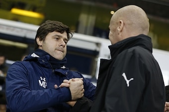 Tottenham Hotspur's Argentinian head coach Mauricio Pochettino (L) greets Tottenham Hotspur's Belgian defender Jan Vertonghen  ahead of the English Premier League football match between Tottenham Hotspur and Burnley at White Hart Lane in London, on Decemb