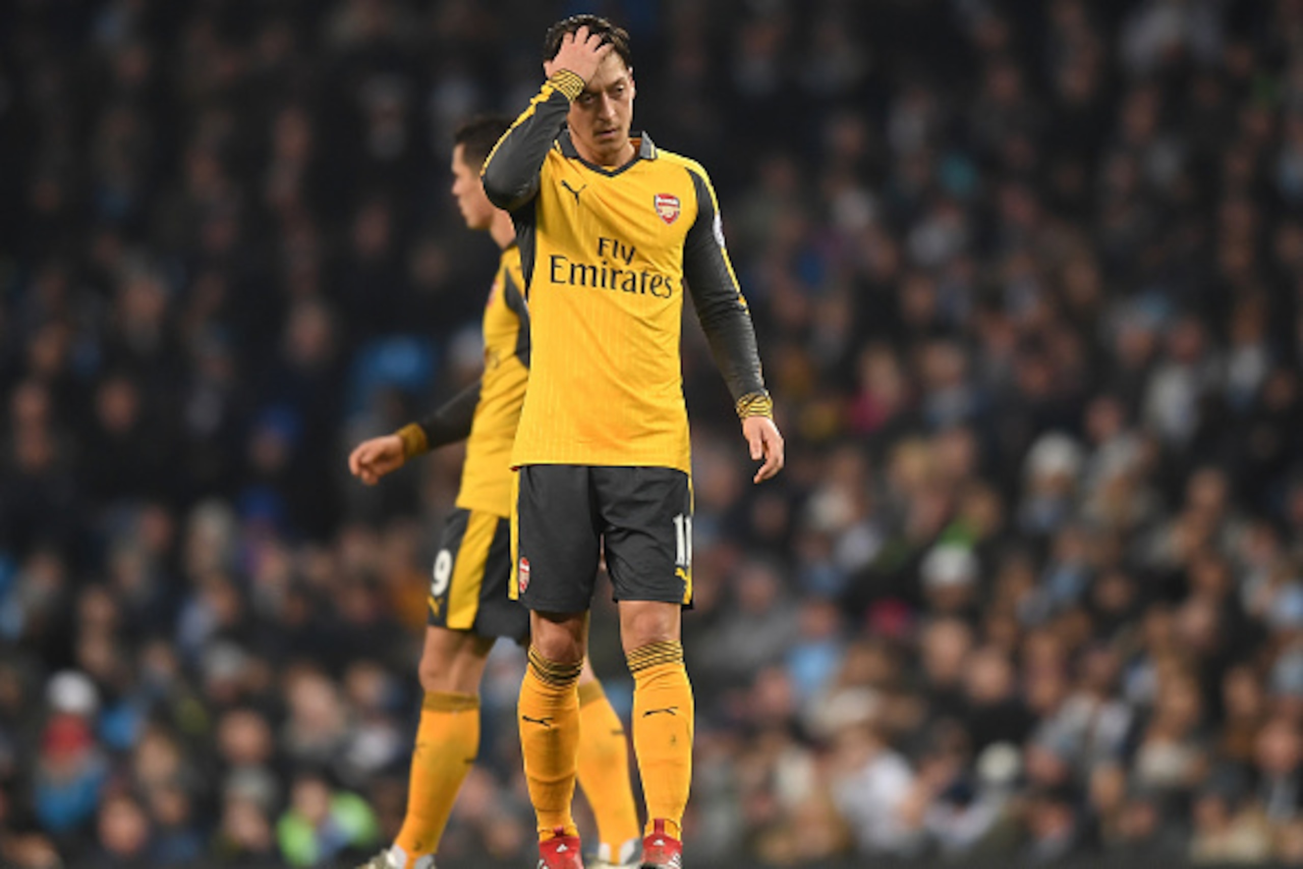 MANCHESTER, ENGLAND - DECEMBER 18:  Mesut Ozil of Arsenal is dejected after the final whistle during the Premier League match between Manchester City and Arsenal at the Etihad Stadium on December 18, 2016 in Manchester, England.  (Photo by Michael Regan/G