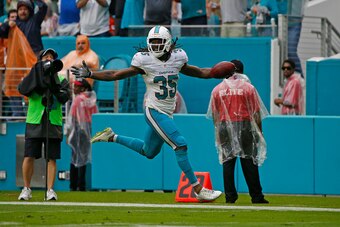 MIAMI GARDENS, FL - DECEMBER 11: Walt Aikens #35 of the Miami Dolphins runs for two points after the point after touchdown by the Arizona Cardinals was blocked on December 11, 2016 at Hard Rock Stadium in Miami Gardens, Florida. The Dolphins defeated the 