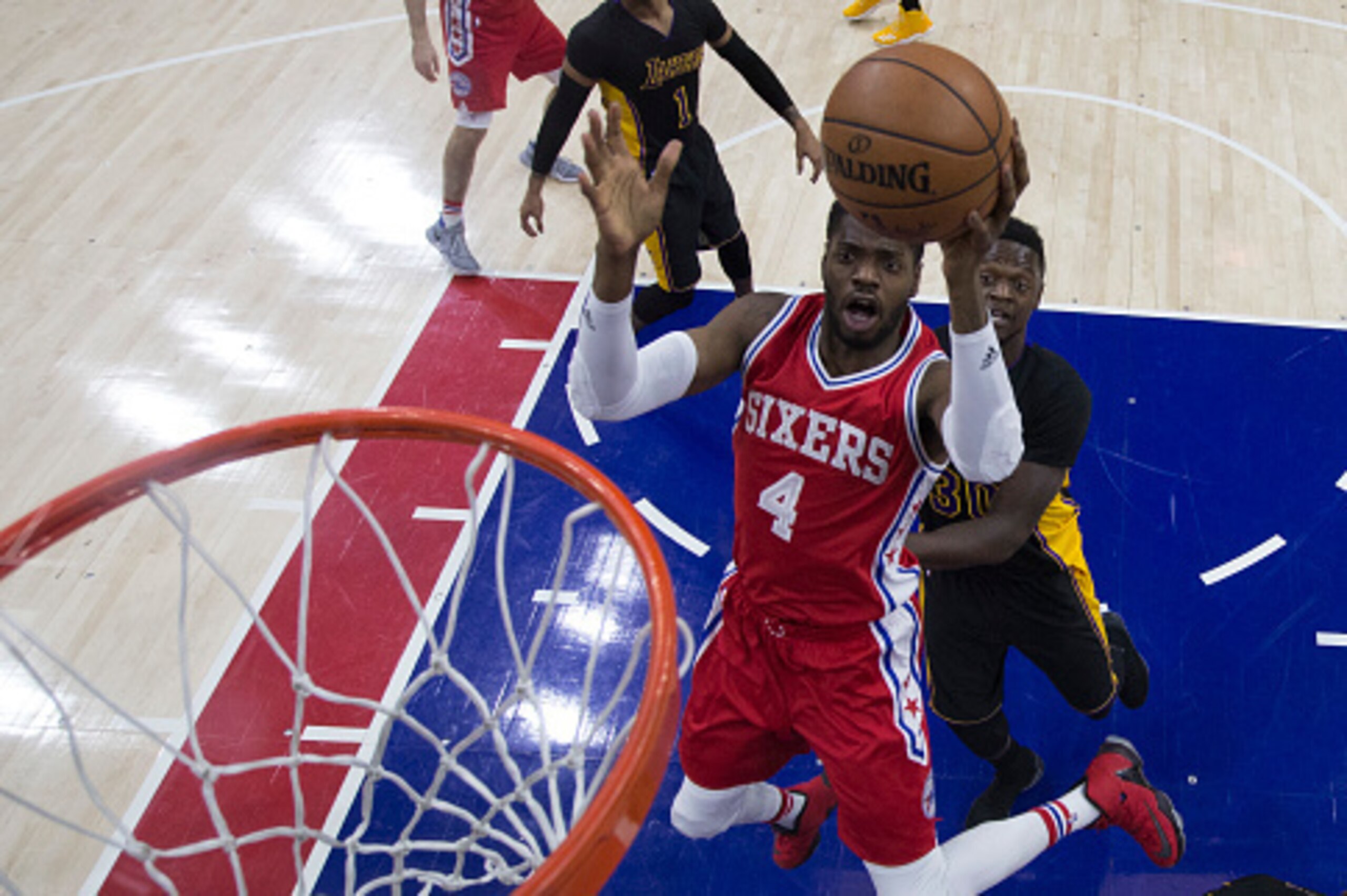 PHILADELPHIA, PA - DECEMBER 16: Nerlens Noel #4 of the Philadelphia 76ers shoots the ball against Julius Randle #30 of the Los Angeles Lakers in the first quarter at Wells Fargo Center on December 16, 2016 in Philadelphia, Pennsylvania. The Lakers defeate