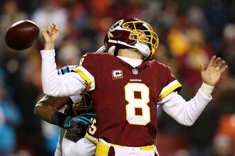 LANDOVER, MD - DECEMBER 19: Quarterback Kirk Cousins #8 of the Washington Redskins fumbles the ball in the third quarter against the Carolina Panthers at FedExField on December 19, 2016 in Landover, Maryland. (Photo by Patrick Smith/Getty Images)