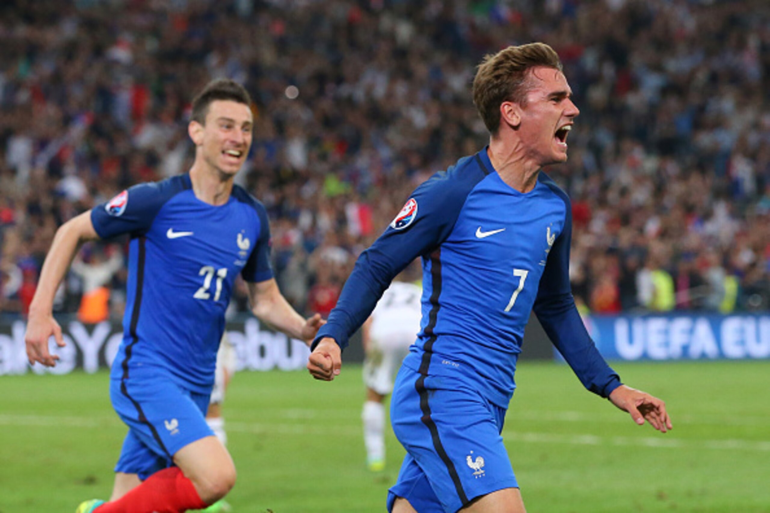MARSEILLE, FRANCE - JUNE 15: Antoine Griezmann of France celebrates with Laurent Koscielny scoring his sides first goal during the UEFA EURO 2016 Group A match between France and Albania at Stade Velodrome on June 15, 2016 in Marseille, France. (Photo b MARSEILLE, FRANCE - JUNE 15: Antoine Griezmann of France celebrates with Laurent Koscielny scoring his sides first goal during the UEFA EURO 2016 Group A match between France and Albania at Stade Velodrome on June 15, 2016 in Marseille, France. (Photo b