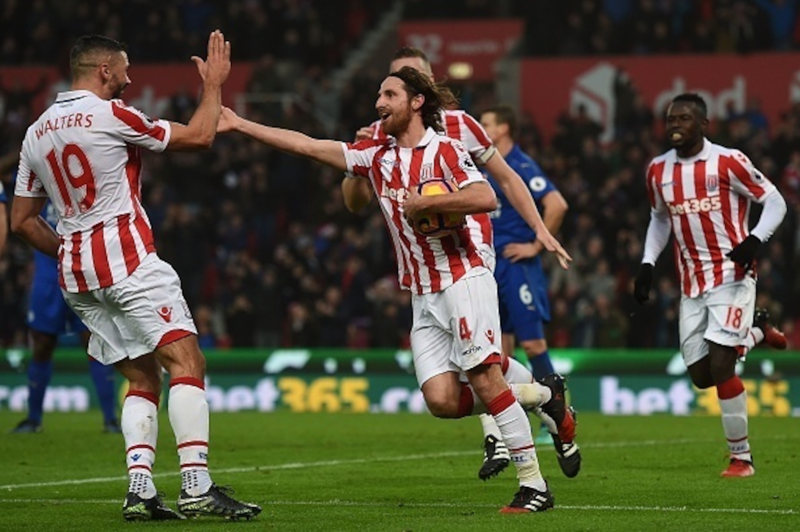 Stoke City's Welsh midfielder Joe Allen (C) celebrates scoring his team's second goal during the English Premier League football match between Stoke City and Leicester City at the Bet365 Stadium in Stoke-on-Trent, central England on December 17, 2016. / A