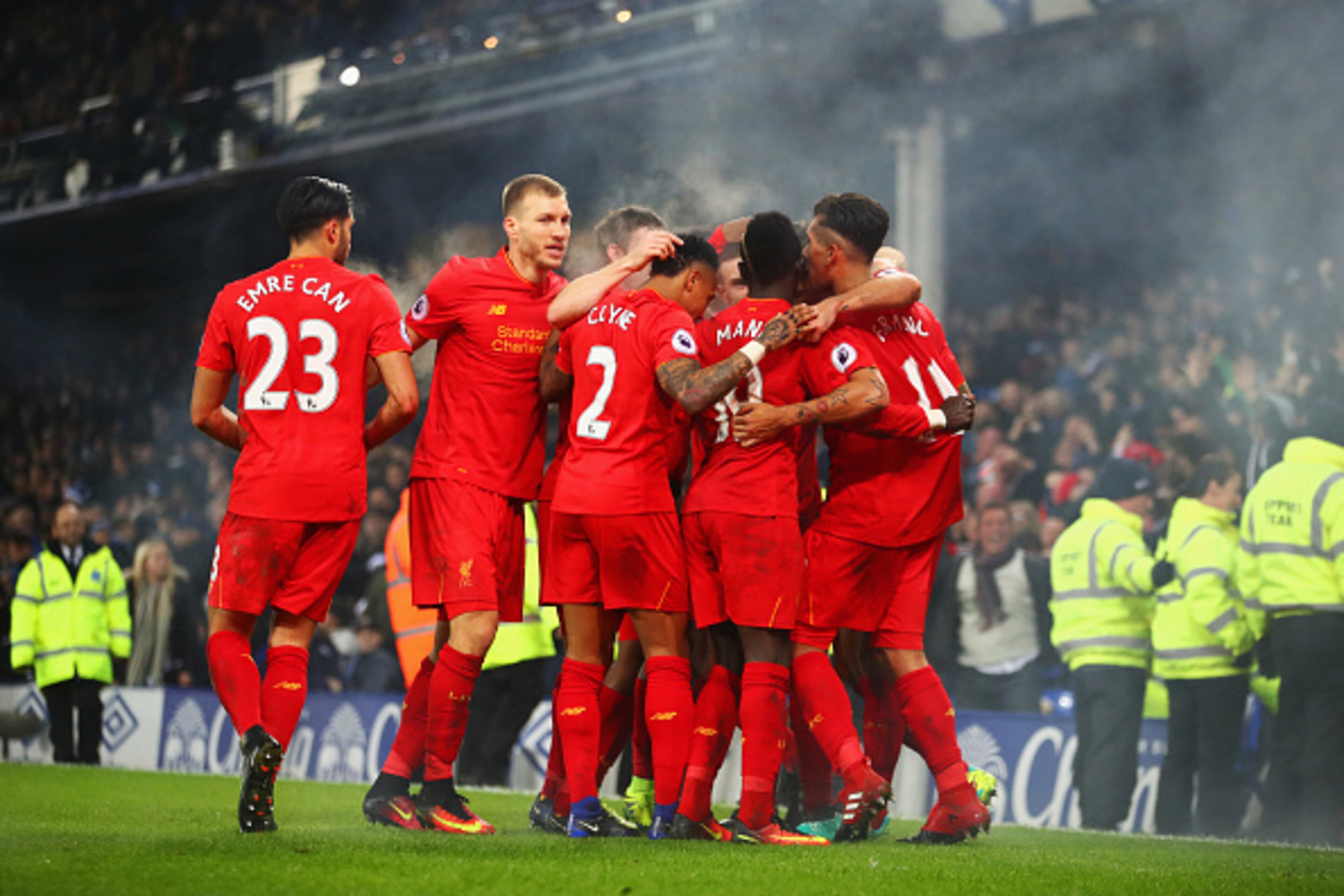 LIVERPOOL, ENGLAND - DECEMBER 19:  Sadio Mane of Liverpool (19) celebrates with team mates as he scores their first goal during the Premier League match between Everton and Liverpool at Goodison Park on December 19, 2016 in Liverpool, England.  (Photo by 