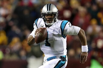 LANDOVER, MD - DECEMBER 19: Quarterback Cam Newton #1 of the Carolina Panthers scrambles with the ball against the Washington Redskins in the second quarter at FedExField on December 19, 2016 in Landover, Maryland. (Photo by Patrick Smith/Getty Images)