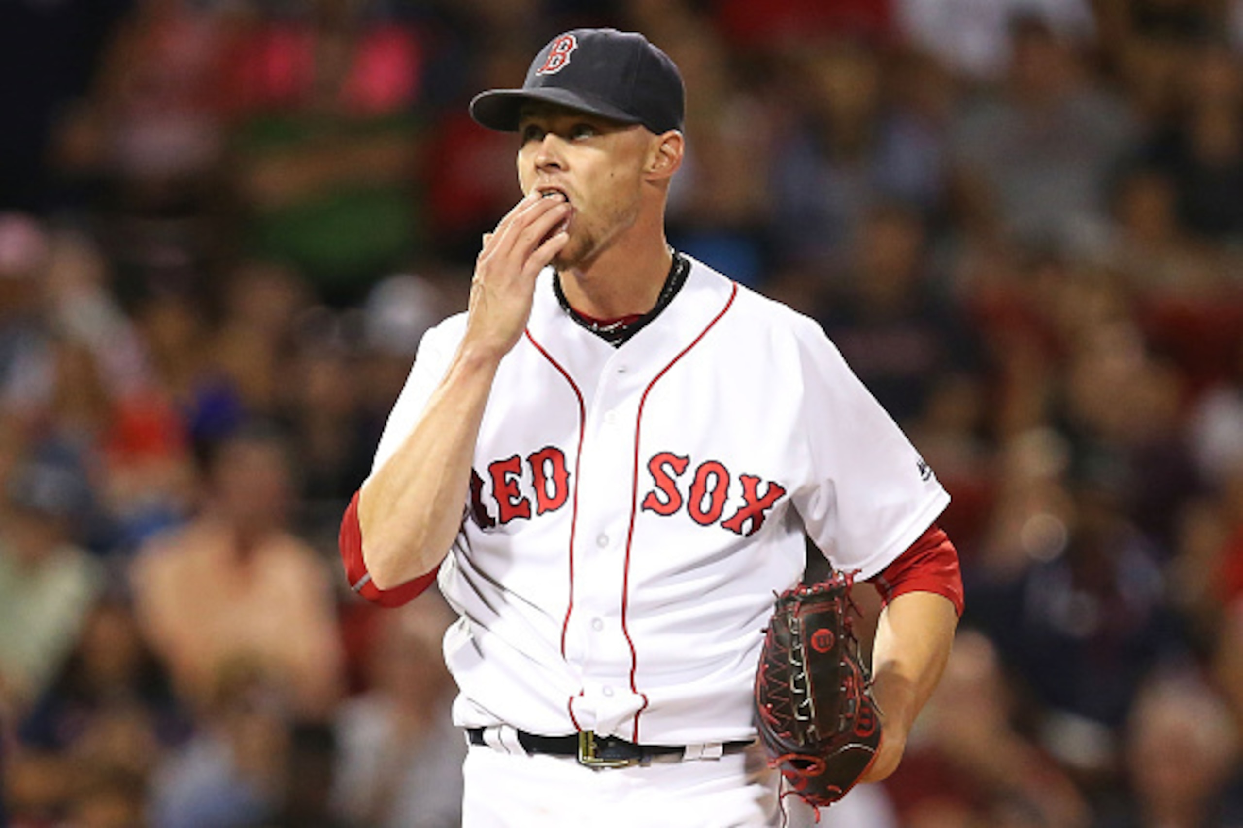 BOSTON, MA - AUGUST 29:  Clay Buchholz #11 of the Boston Red Sox licks his fingers in the eighth inning during a game against the Tampa Bay Rays at Fenway Park on August 29, 2016 in Boston, Massachusetts.  (Photo by Adam Glanzman/Getty Images)