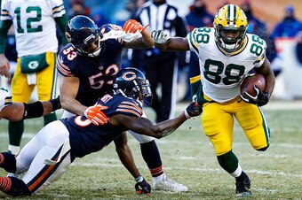 CHICAGO, IL - DECEMBER 18:   Demontre Hurst #30 of the Chicago Bears grabs onto  Ty Montgomery #88 of the Green Bay Packers in the third quarter at Soldier Field on December 18, 2016 in Chicago, Illinois.  (Photo by Joe Robbins/Getty Images)