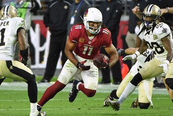 GLENDALE, AZ - DECEMBER 18:  Wide receiver Larry Fitzgerald #11 of the Arizona Cardinals runs with the football in NFL game against the New Orleans Saints at University of Phoenix Stadium on December 18, 2016 in Glendale, Arizona.  The New Orleans Saints 