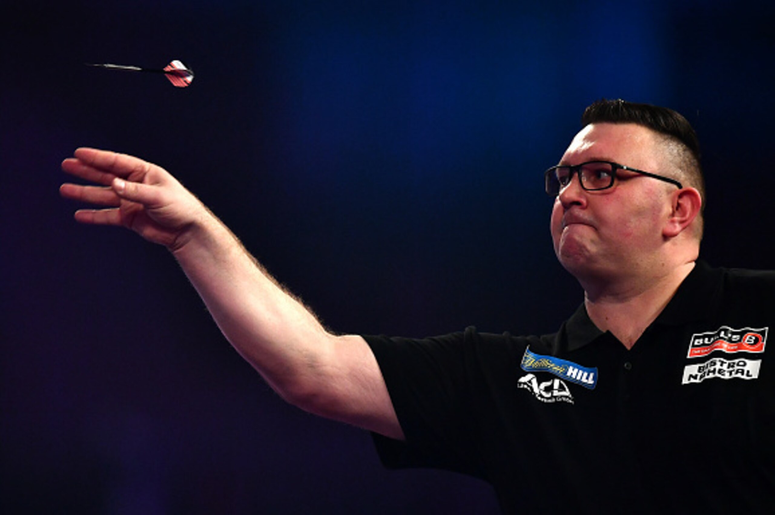 LONDON, ENGLAND - DECEMBER 20:   Dragutin Horvat of Germany throws against Boris Koltsov of Russia during the first round match on day six of the 2017 William Hill PDC World Darts Championships at Alexandra Palace on December 20, 2016 in London, England. 