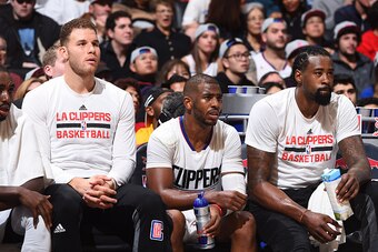 LOS ANGELES, CA - NOVEMBER 21: Blake Griffin #32, Chris Paul #3 and DeAndre Jordan #6 of the LA Clippers show emotion on the bench during the game against the Toronto Raptors at STAPLES Center on November 21, 2016 in Los Angeles, California. NOTE TO USER: