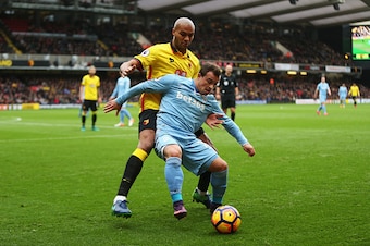 WATFORD, ENGLAND - NOVEMBER 27: Younes Kaboul of Watford (L) and Xherdan Shaqiri of Stoke City (R) battle for possession during the Premier League match between Watford and Stoke City at Vicarage Road on November 27, 2016 in Watford, England.  (Photo by A