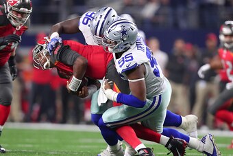 ARLINGTON, TX - DECEMBER 18:  David Irving #95 and Maliek Collins #96 of the Dallas Cowboys sack Jameis Winston #3 of the Tampa Bay Buccaneers during the fourth quarter at AT&T Stadium on December 18, 2016 in Arlington, Texas. (Photo by Tom Pennington/Get