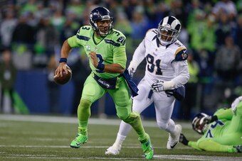 SEATTLE, WA - DECEMBER 15:  Quarterback Russell Wilson #3 of the Seattle Seahawks rushes against the Los Angeles Rams at CenturyLink Field on December 15, 2016 in Seattle, Washington.  (Photo by Otto Greule Jr/Getty Images)