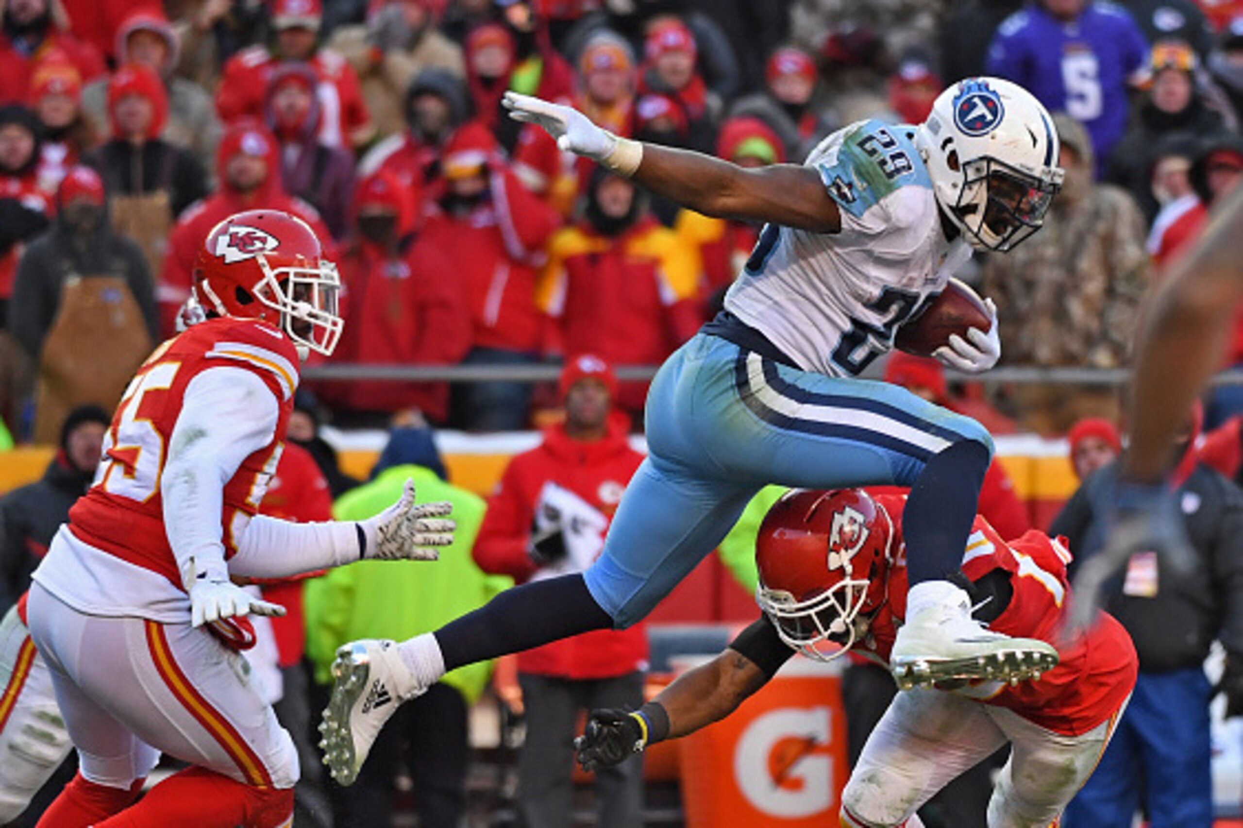 KANSAS CITY, MO - DECEMBER 18: Running back DeMarco Murray #29 of the Tennessee Titans leaps over a the Kansas City Chiefs defender during the second half on December 18, 2016 at Arrowhead Stadium in Kansas City, Missouri. (Photo by Peter Aiken/Getty Imag