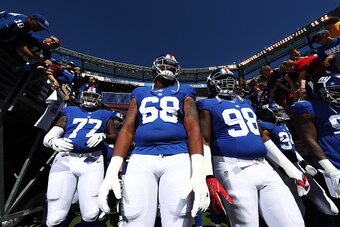 EAST RUTHERFORD, NJ - SEPTEMBER 25:   John Jerry #77,  Bobby Hart #68, and  Damon Harrison #98 of the New York Giants wait to enter the field against the Washington Redskins before their game at MetLife Stadium on September 25, 2016 in East Rutherford, Ne