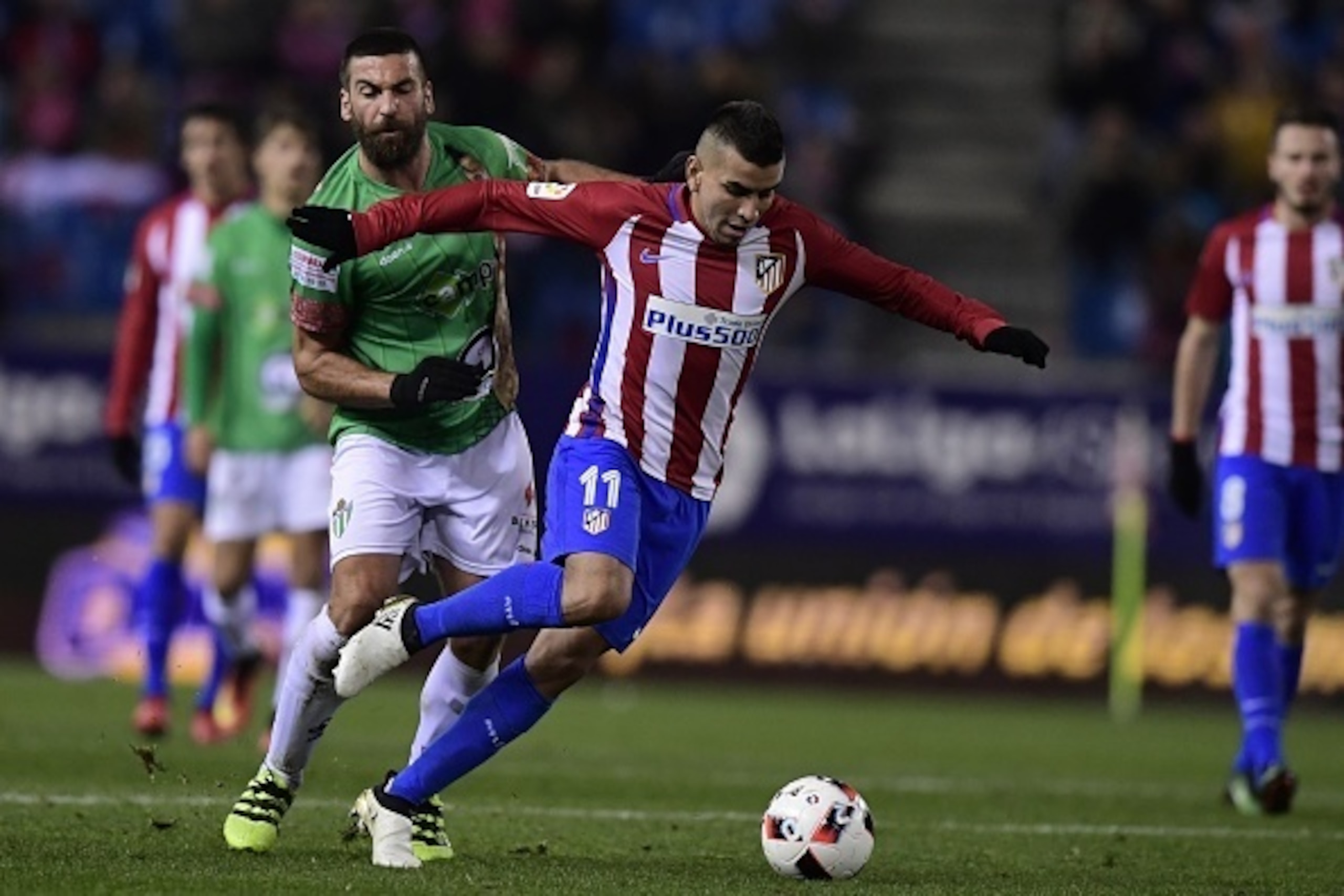 Atletico Madrid's Argentinian midfielder Angel Correa (R) vies with Guijuelo's midfielder Carles Marc during the Spanish Copa del Rey (King's Cup) round of 32 second leg football match Club Atletico de Madrid vs CD Guijuelo at the Vicente Calderon stadium Atletico Madrid's Argentinian midfielder Angel Correa (R) vies with Guijuelo's midfielder Carles Marc during the Spanish Copa del Rey (King's Cup) round of 32 second leg football match Club Atletico de Madrid vs CD Guijuelo at the Vicente Calderon stadium