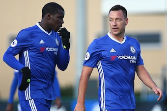 COBHAM, ENGLAND - NOVEMBER 21: Kurt Zouma of Chelsea (L) and John Terry (R) speak during the Premier League 2 match between Chelsea and Southampton at Chelsea Training Ground on November 21, 2016 in Cobham, England.  (Photo by Alex Pantling/Getty Images)
