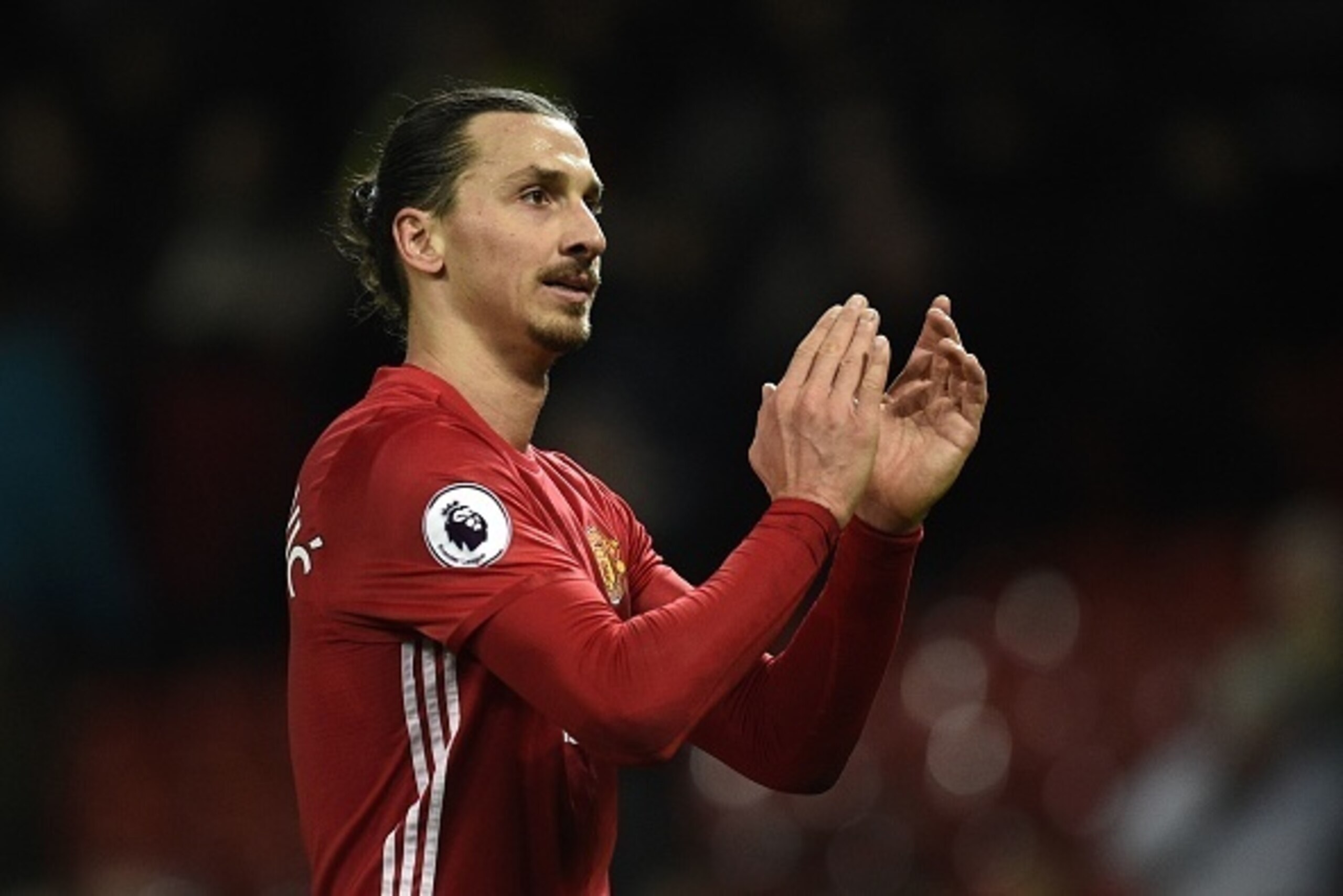 Manchester United's Swedish striker Zlatan Ibrahimovic applauds supporters as he walks from the pitch after the English Premier League football match between Manchester United and Tottenham Hotspur at Old Trafford in Manchester, north west England, on Dec