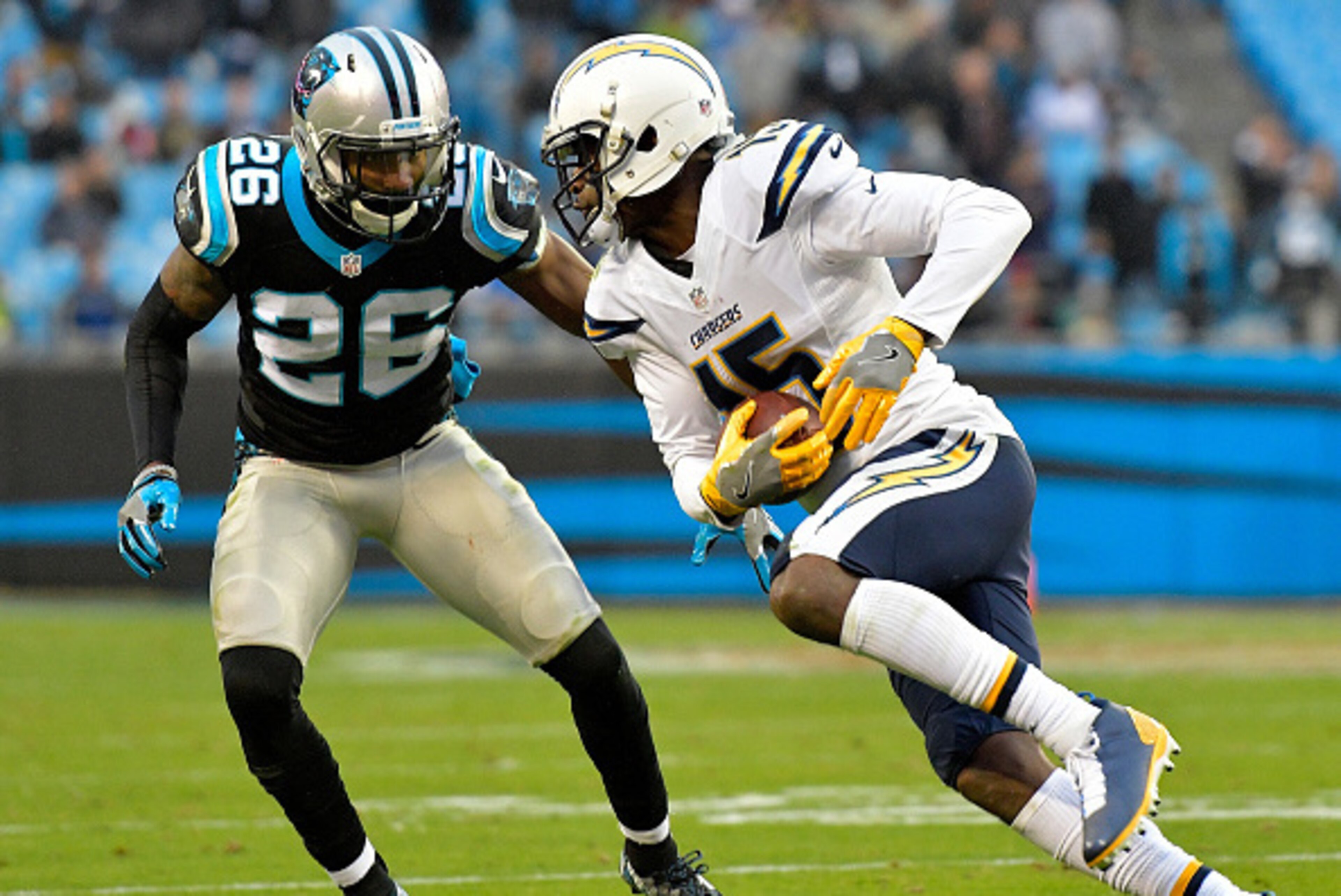 CHARLOTTE, NC - DECEMBER 11:  Dontrelle Inman #15 of the San Diego Chargers runs the ball against Daryl Worley #26 of the Carolina Panthers in the 4th quarter during the game at Bank of America Stadium on December 11, 2016 in Charlotte, North Carolina.  (