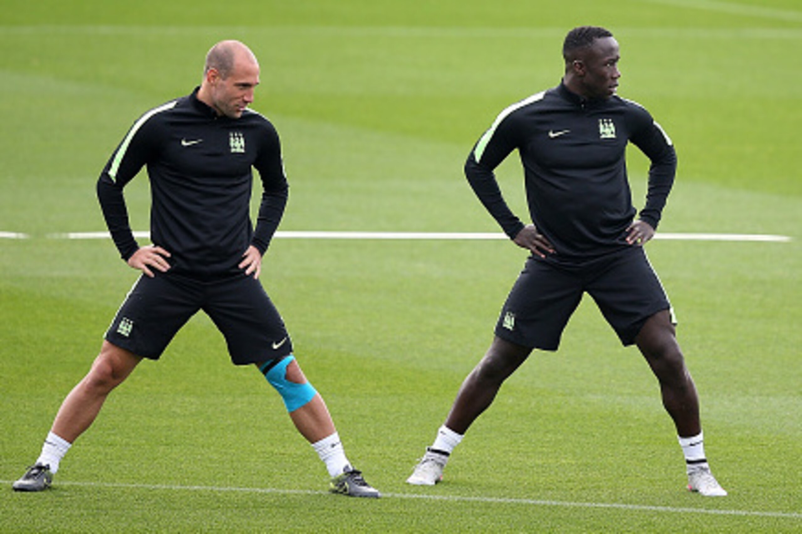 MANCHESTER, ENGLAND - SEPTEMBER 29:  (L-R) Pablo Zabaleta, Bacary Sagna and Samir Nasri chat during a Manchester City training session ahead of their Champions League fixture against Borussia Moenchengladbach at City Football Academy on September 29, 2015