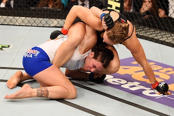 LOS ANGELES, CA - FEBRUARY 28:  (Top) Ronda Rousey grapples with Cat Zingano in their UFC women's bantamweight championship bout during the UFC 184 event at Staples Center on February 28, 2015 in Los Angeles, California.  (Photo by Josh Hedges/Zuffa LLC/Z