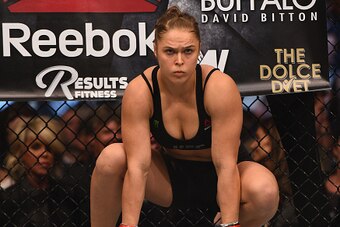 LOS ANGELES, CA - FEBRUARY 28:  Ronda Rousey enters the Octagon in her UFC women's bantamweight championship bout against Cat Zingano during the UFC 184 event at Staples Center on February 28, 2015 in Los Angeles, California.  (Photo by Jeff Bottari/Zuffa