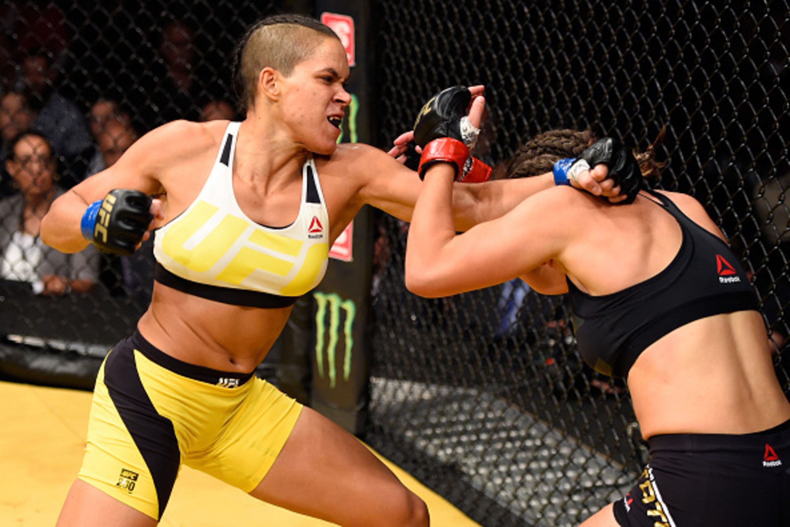LAS VEGAS, NV - JULY 09:  (L-R) Amanda Nunes of Brazil punches Miesha Tate in their UFC women's bantamweight championship bout during the UFC 200 event at T-Mobile Arena on July 9, 2016 in Las Vegas, Nevada. (Photo by Josh Hedges/Zuffa LLC/Zuffa LLC via G