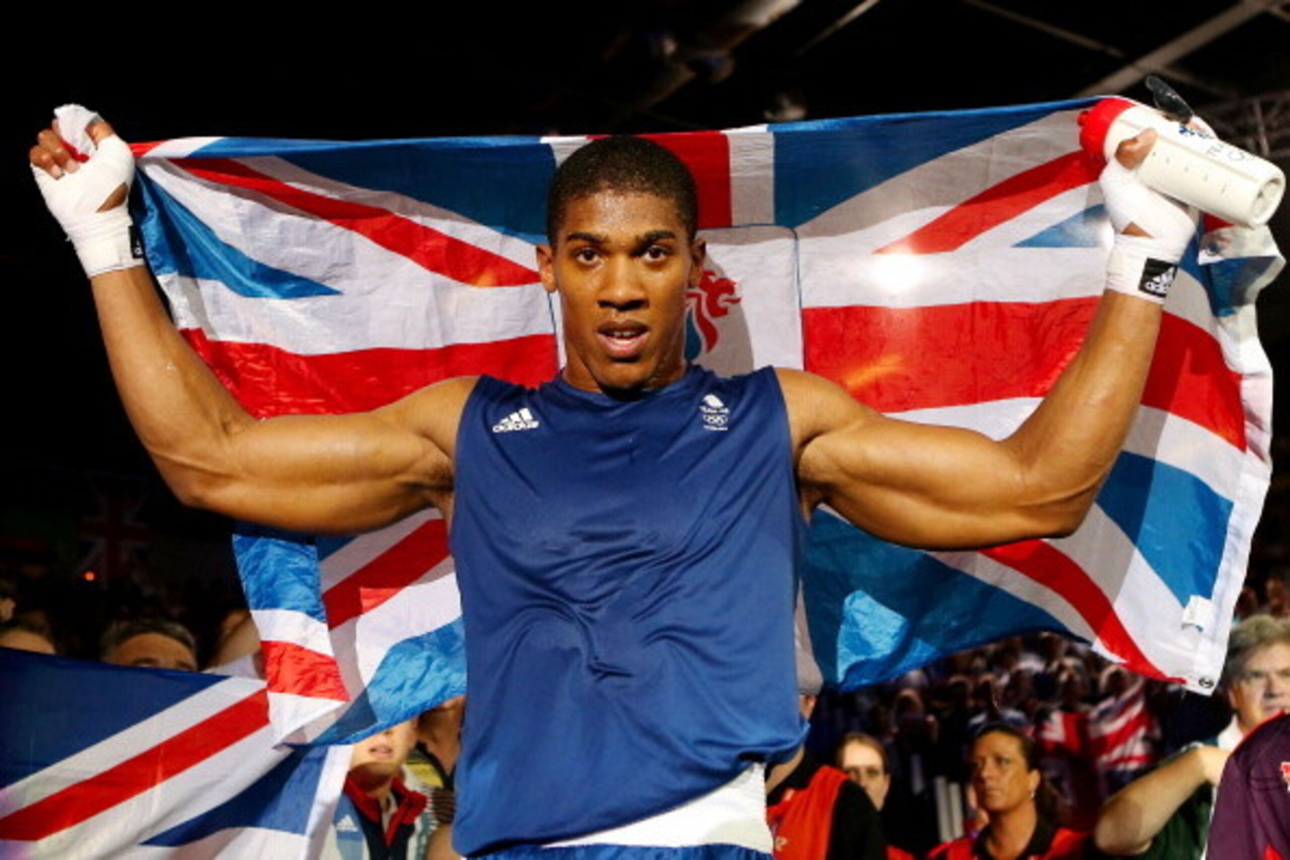 LONDON, ENGLAND - AUGUST 12:  Anthony Joshua of Great Britain celebrates defeating Roberto Cammarelle of Italy to win the Men's Super Heavy (+91kg) Boxing final bout on Day 16 of the London 2012 Olympic Games at ExCeL on August 12, 2012 in London, England