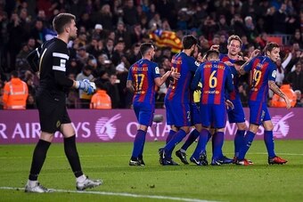 Barcelona's Turkish midfielder Arda Turan (C) is congratulated by his teammates after scoring during the Spanish Copa del Rey (King's Cup) round of 32 second leg football match FC Barcelona vs Hercules CF at the Camp Nou stadium in Barcelona on December 2