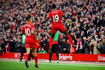 LIVERPOOL, ENGLAND - NOVEMBER 06:  Sadio Mane of Liverpool celebrates scoring his sides first goal with Philippe Coutinho of Liverpool during the Premier League match between Liverpool and Watford at Anfield on November 6, 2016 in Liverpool, England.  (Ph