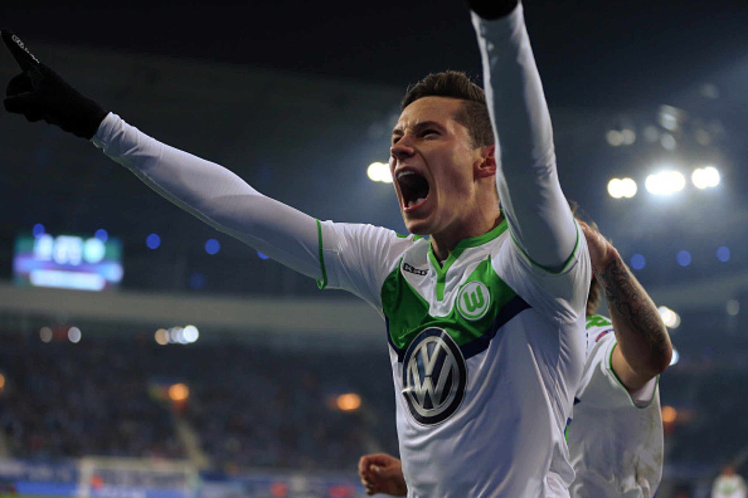 GENT, BELGIUM - FEBRUARY 17 : Julian Draxler of Wolfsburg celebrates after he scores a goal to make it 0-1 during the UEFA Champions League match between KAA Gent and VfL Wolfsburg at Ghelamco Arena, on February 17, 2016 in Gent, Belgium. (Photo by Cather