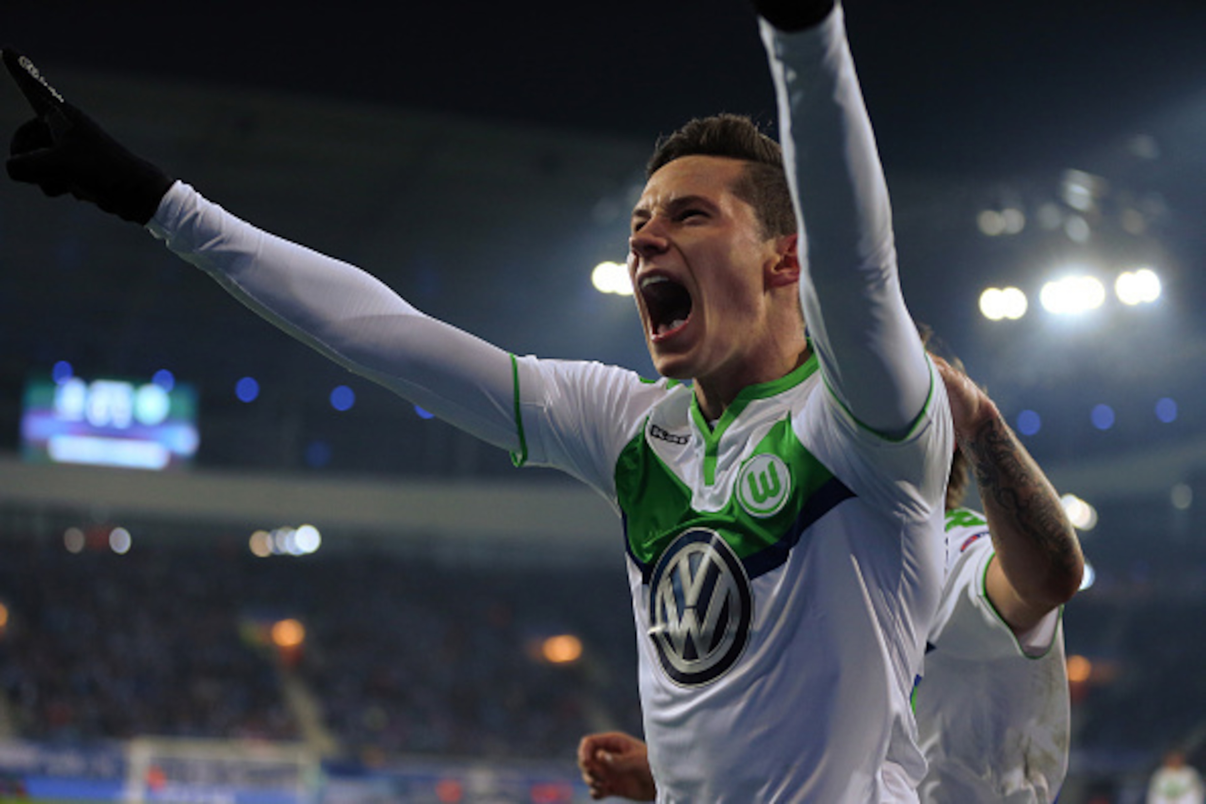 GENT, BELGIUM - FEBRUARY 17 : Julian Draxler of Wolfsburg celebrates after he scores a goal to make it 0-1 during the UEFA Champions League match between KAA Gent and VfL Wolfsburg at Ghelamco Arena, on February 17, 2016 in Gent, Belgium. (Photo by Cather GENT, BELGIUM - FEBRUARY 17 : Julian Draxler of Wolfsburg celebrates after he scores a goal to make it 0-1 during the UEFA Champions League match between KAA Gent and VfL Wolfsburg at Ghelamco Arena, on February 17, 2016 in Gent, Belgium. (Photo by Cather