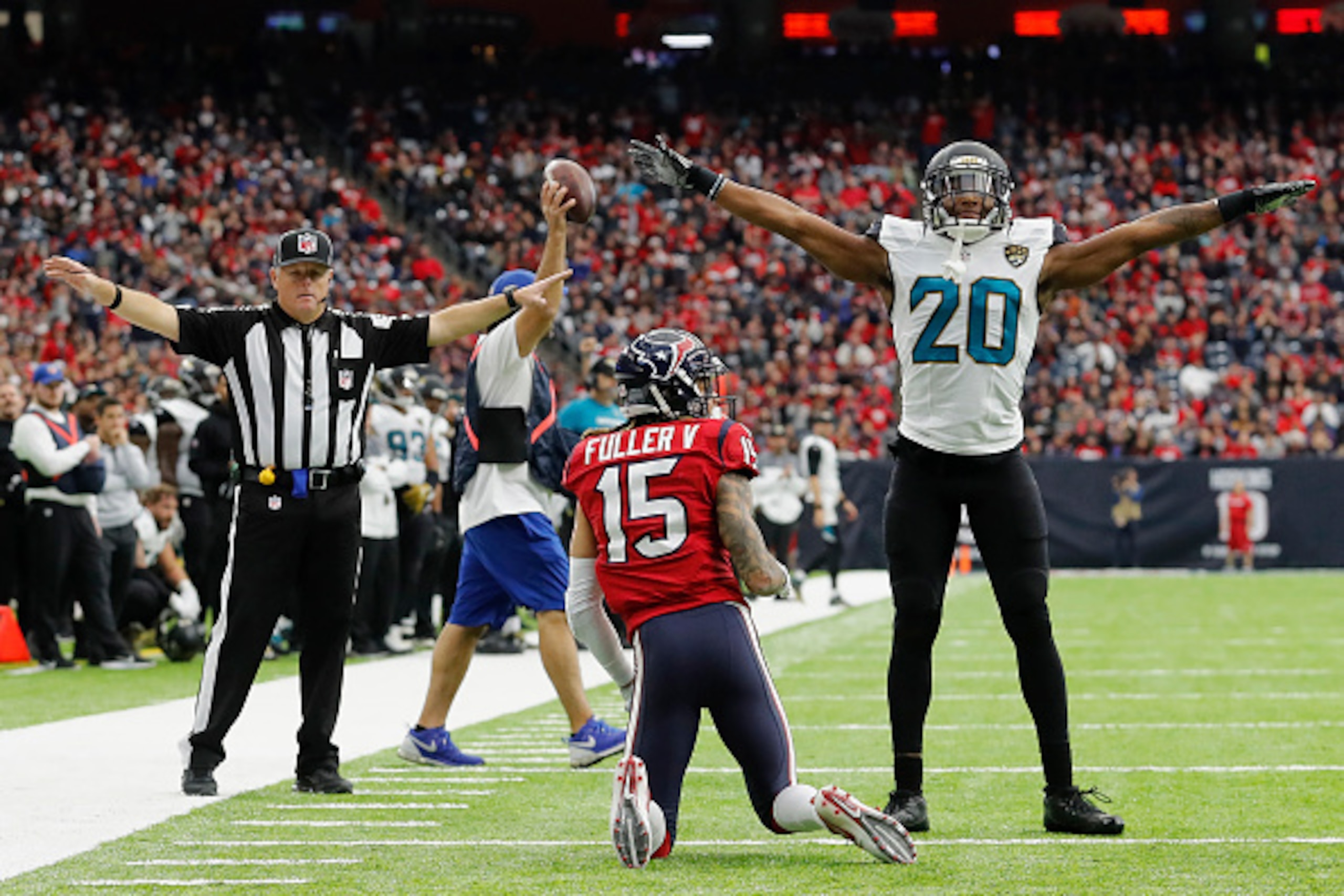 HOUSTON, TX - DECEMBER 18:  Jalen Ramsey #20 of the Jacksonville Jaguars signals incomplete after defending Will Fuller #15 of the Houston Texans in the fourth quarter at NRG Stadium on December 18, 2016 in Houston, Texas.  (Photo by Tim Warner/Getty Imag