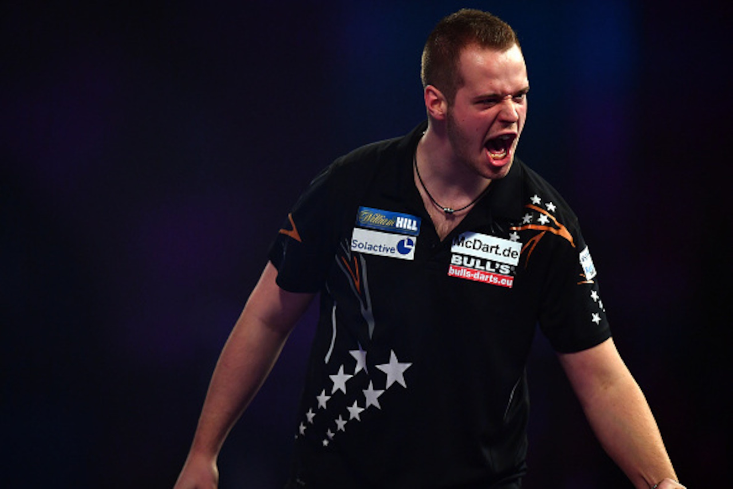 LONDON, ENGLAND - DECEMBER 22: Max Hopp of Germany reacts during his first round match against Vincent van der Voort of the Netherlands on day eight of the 2017 William Hill PDC World Darts Championships at Alexandra Palace on December 22, 2016 in London LONDON, ENGLAND - DECEMBER 22: Max Hopp of Germany reacts during his first round match against Vincent van der Voort of the Netherlands on day eight of the 2017 William Hill PDC World Darts Championships at Alexandra Palace on December 22, 2016 in London