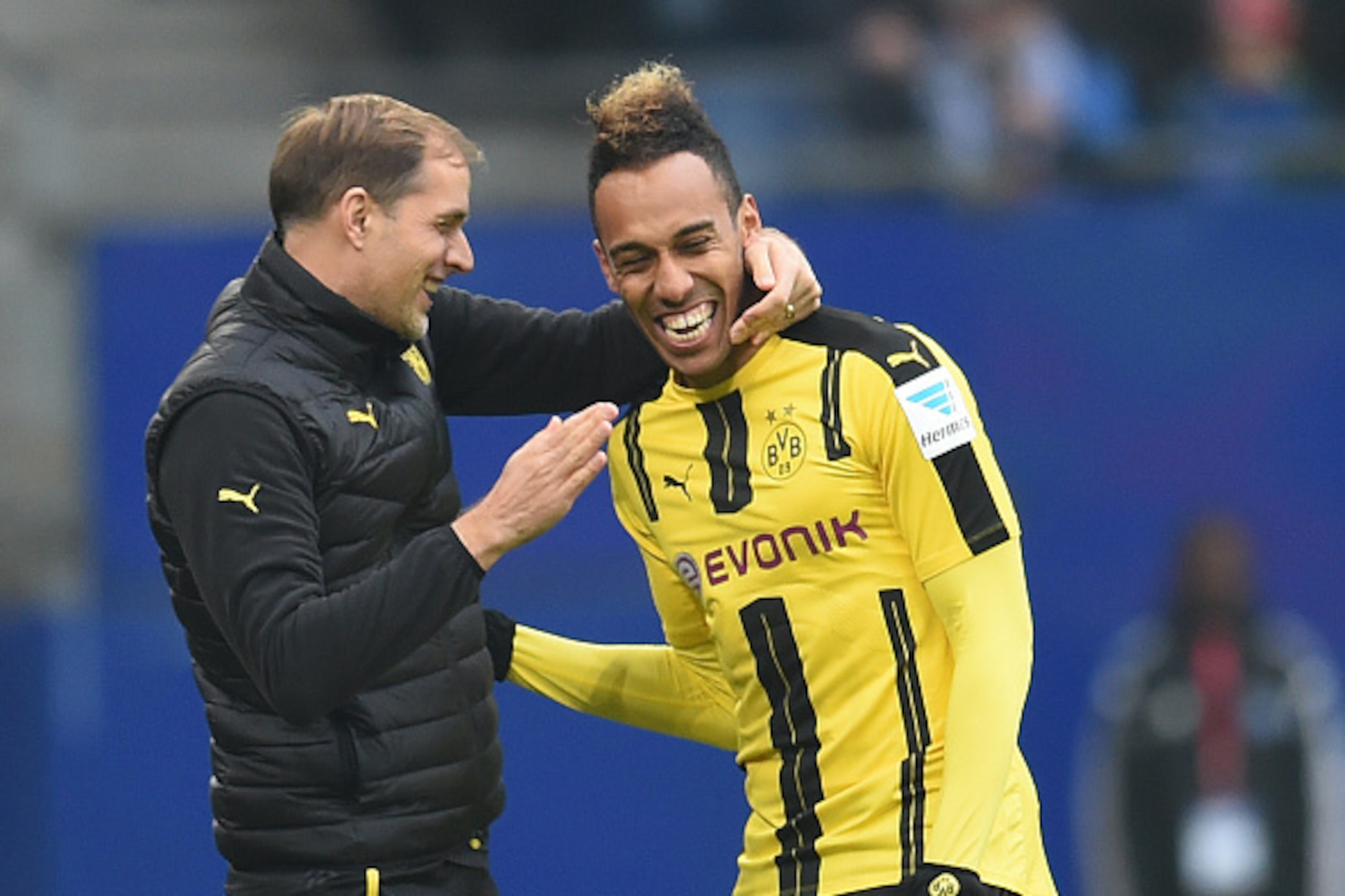 Pierre-Emerick Aubameyang from Dortmund celebrateS with coach Thomas Tuchel (L) his goal during the German first division Bundesliga football match between Hamburg SV and BVB Borussia Dortmund in Hamburg, northern Germany, on November 5, 2016.  / AFP / CA