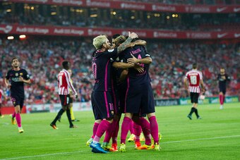BILBAO, SPAIN - AUGUST 28:  Ivan Rakitic (R) of FC Barcelona celebrates with his teammate Lionel Messi, Denis Suarez and  Luis Suarez of FC Barcelona after scoring the opening goal during the La Liga match between Athletic Club Bilbao and FC Barcelona at 