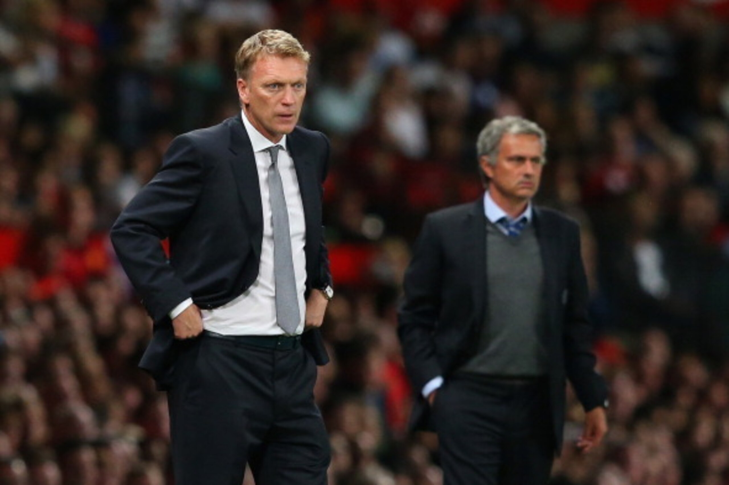 MANCHESTER, ENGLAND - AUGUST 26:  Manchester United Manager David Moyes and Chelsea Manager Jose Mourinho (R) look on during the Barclays Premier League match between Manchester United and Chelsea at Old Trafford on August 26, 2013 in Manchester, England.