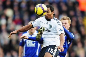 BIRMINGHAM, ENGLAND - DECEMBER 26: Florent Malouda of Chelsea is challenged by Sebastian Larsson of Birmingham City during the Barclays Premier League match between Birmingham City and Chelsea at St. Andrew's Stadium on December 26, 2009 in Birmingham, En