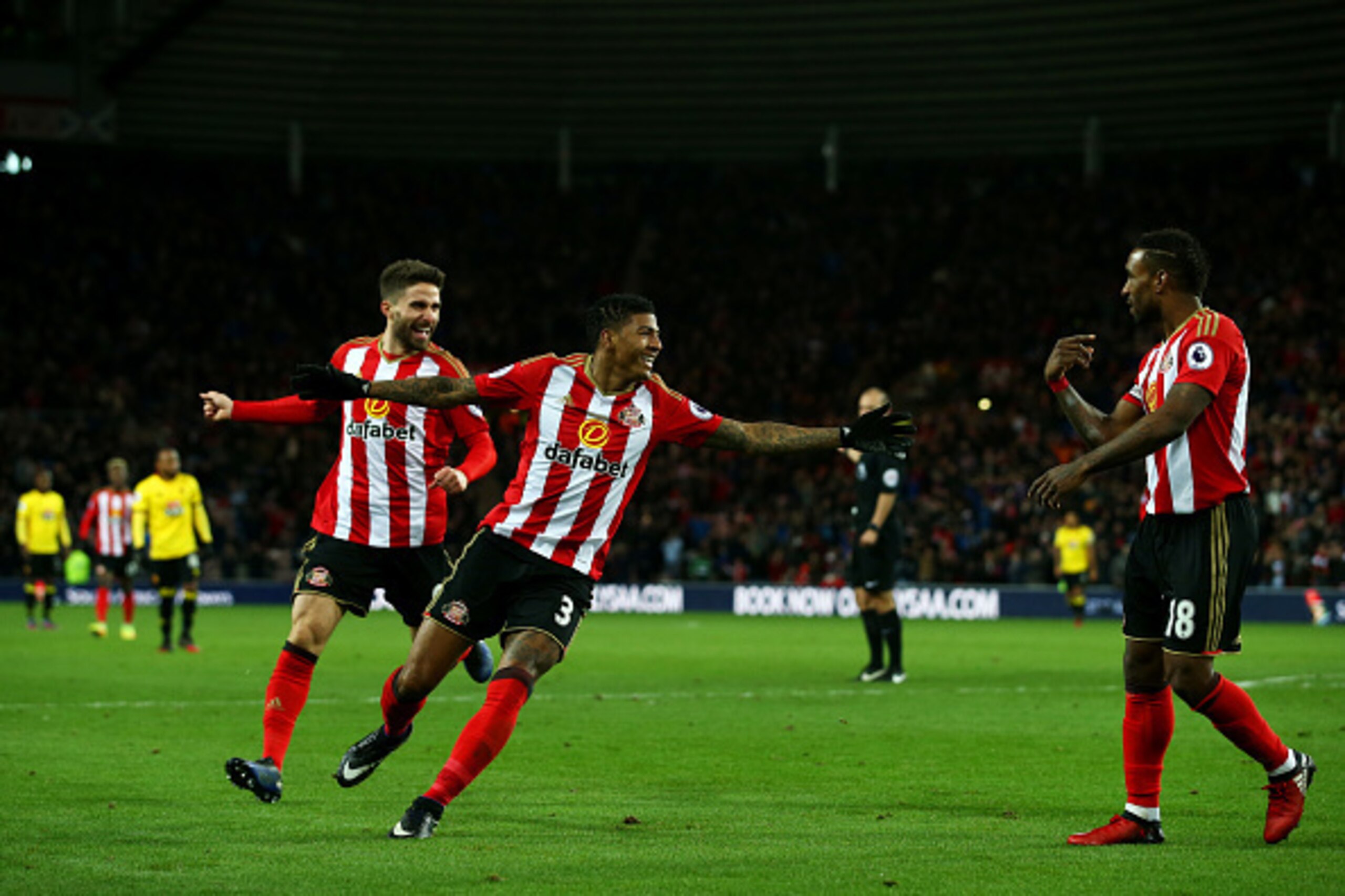 SUNDERLAND, ENGLAND - DECEMBER 17:  Patrick van Aanholt of Sunderland (C) celebrates scoring his sides first goal with Jermain Defoe of Sunderland (R) during the Premier League match between Sunderland and Watford at Stadium of Light on December 17, 2016 
