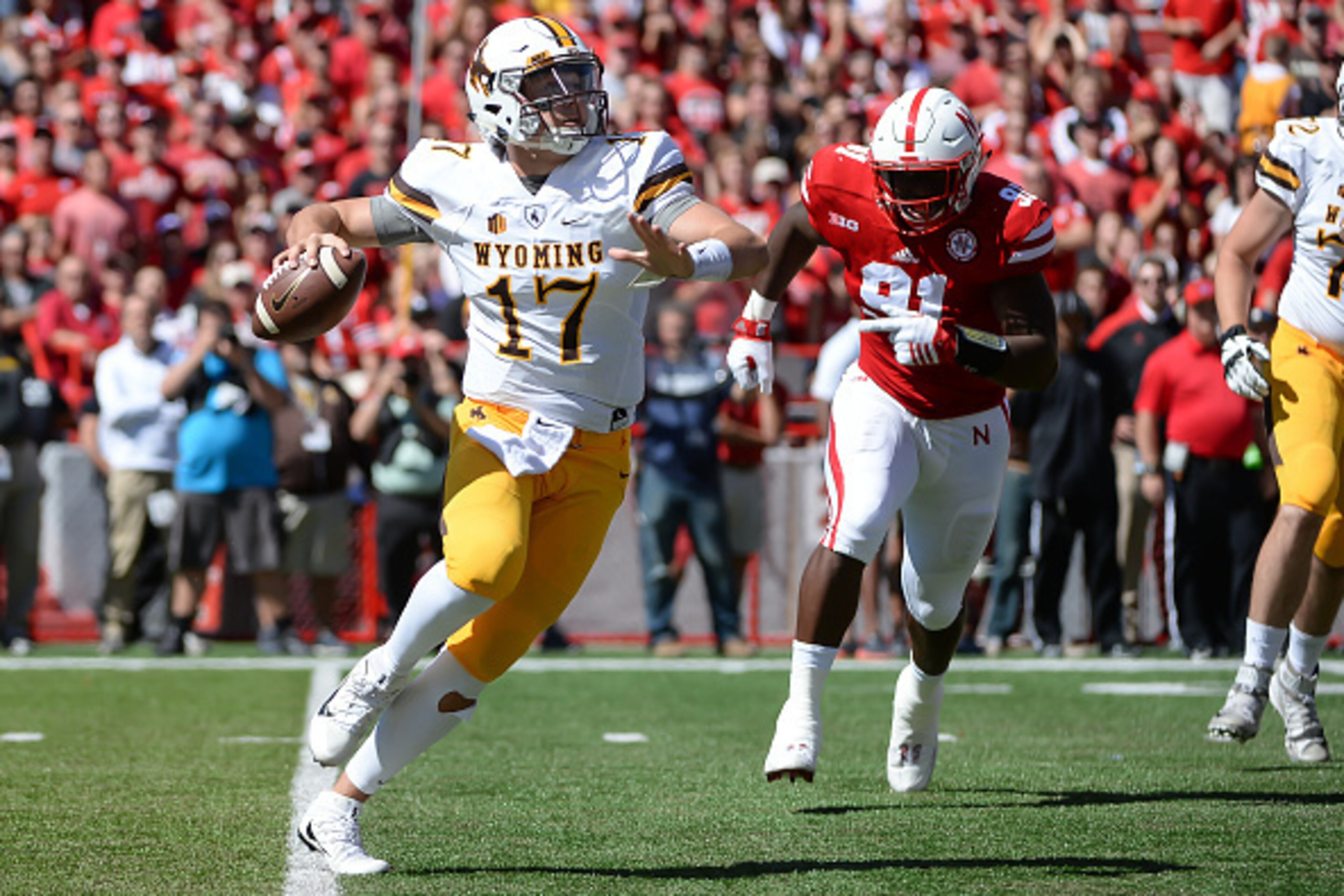 LINCOLN, NE - SEPTEMBER 10: Quarterback Josh Allen #17 of the Wyoming Cowboys passes against defensive end Freedom Akinmoladun #91 of the Nebraska Cornhuskers at Memorial Stadium on September 10, 2016 in Lincoln, Nebraska. (Photo by Steven Branscombe/Gett LINCOLN, NE - SEPTEMBER 10: Quarterback Josh Allen #17 of the Wyoming Cowboys passes against defensive end Freedom Akinmoladun #91 of the Nebraska Cornhuskers at Memorial Stadium on September 10, 2016 in Lincoln, Nebraska. (Photo by Steven Branscombe/Gett