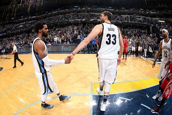 MEMPHIS, TN - DECEMBER 23: Marc Gasol #33 and Mike Conley #11 of the Memphis Grizzlies shake hands after the game against the Houston Rockets on December 23, 2016 at FedExForum in Memphis, Tennessee. NOTE TO USER: User expressly acknowledges and agrees th