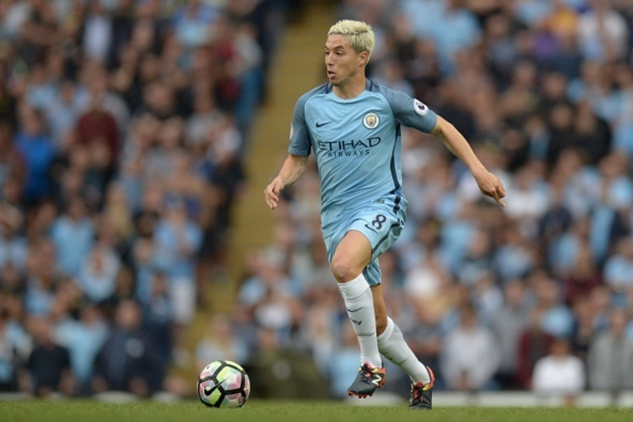 Manchester City's French midfielder Samir Nasri runs with the ball during the English Premier League football match between Manchester City and West Ham United at the Etihad Stadium in Manchester, north west England, on August 28, 2016. / AFP / OLI SCARFF