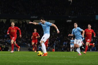 MANCHESTER, ENGLAND - DECEMBER 26:  Alvaro Negredo of Manchester City shoots to score his team's second goal during the Barclays Premier League match between Manchester City and Liverpool at Etihad Stadium on December 26, 2013 in Manchester, England.  (Ph