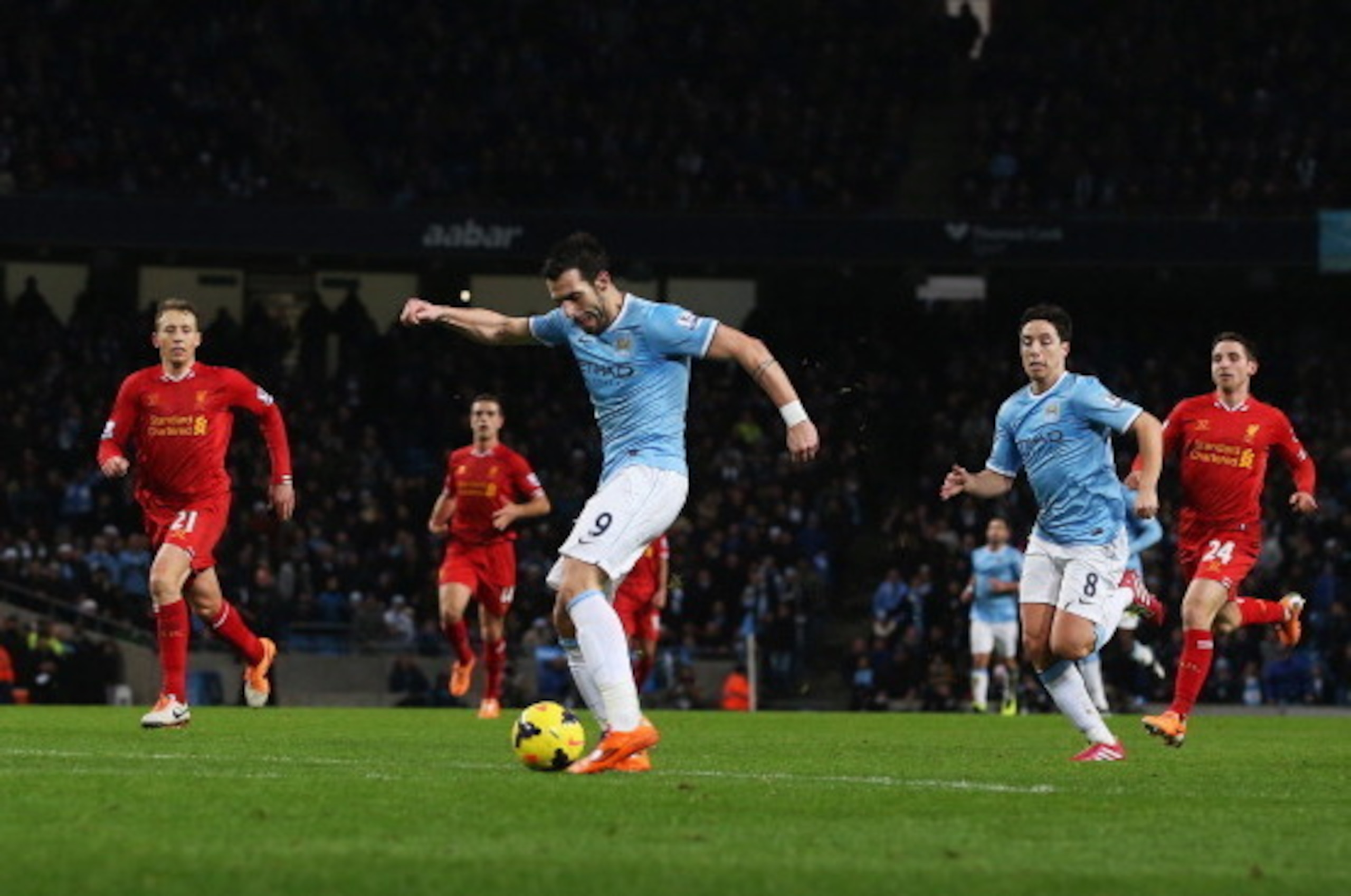 MANCHESTER, ENGLAND - DECEMBER 26: Alvaro Negredo of Manchester City shoots to score his team's second goal during the Barclays Premier League match between Manchester City and Liverpool at Etihad Stadium on December 26, 2013 in Manchester, England. (Ph MANCHESTER, ENGLAND - DECEMBER 26: Alvaro Negredo of Manchester City shoots to score his team's second goal during the Barclays Premier League match between Manchester City and Liverpool at Etihad Stadium on December 26, 2013 in Manchester, England. (Ph