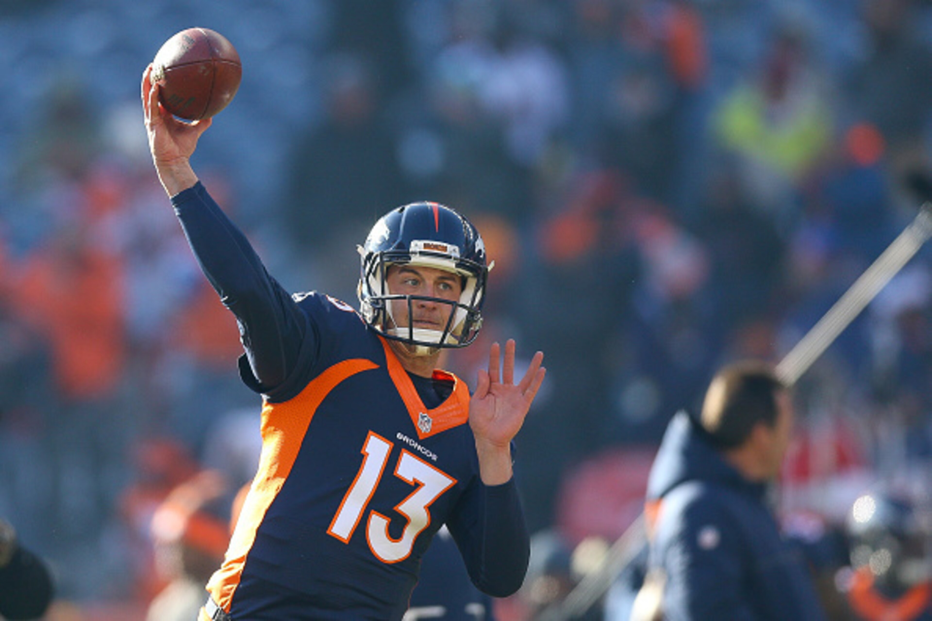 DENVER, CO - DECEMBER 18:  Quarterback Trevor Siemian #13 of the Denver Broncos throws as he warms up before a game against the New England Patriots at Sports Authority Field at Mile High on December 18, 2016 in Denver, Colorado. (Photo by Justin Edmonds/